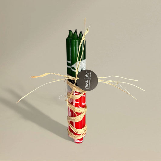 Three red, green and white splashed Christmas dining candles